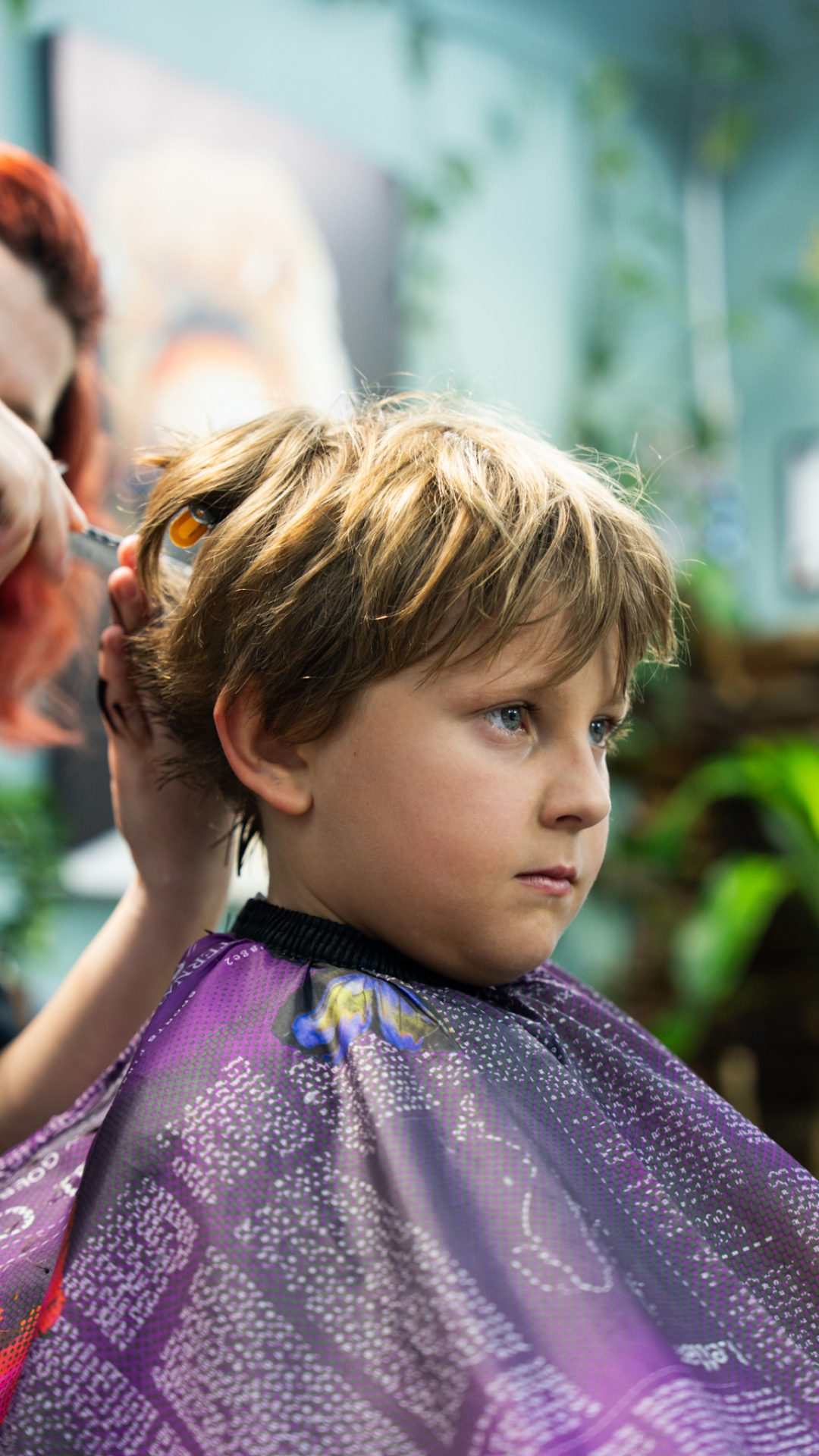 Boy getting a haircut at Best Barber Shop