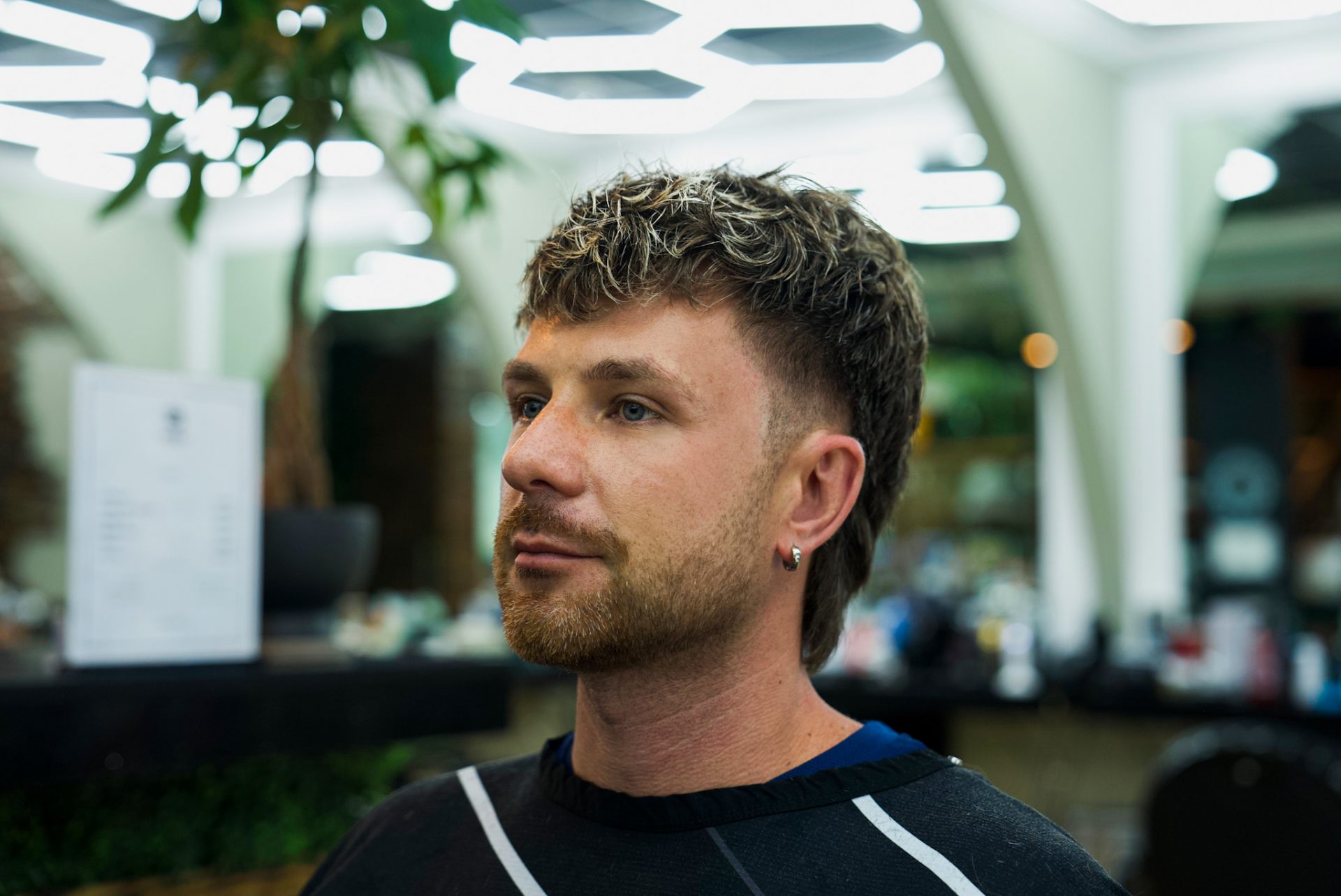 Client with a fresh textured haircut at Best Barber Shop